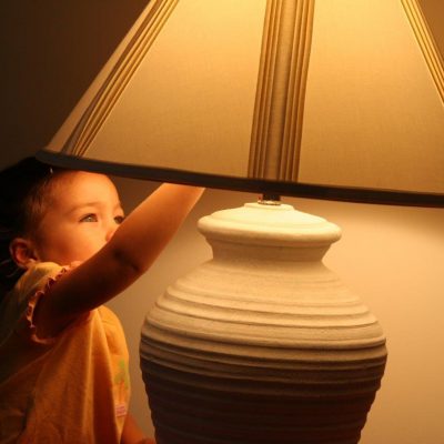 child-turning-off-a-light